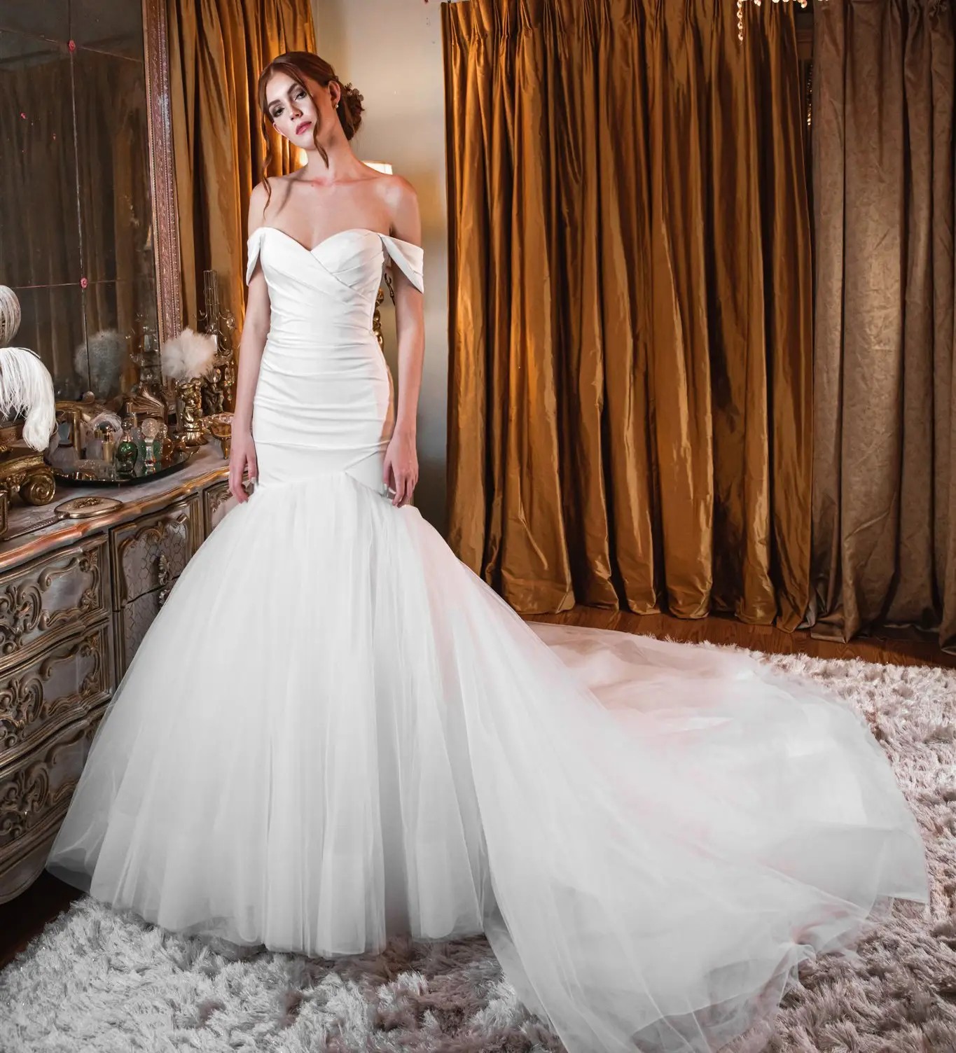 Model wearing a white mermaid gown