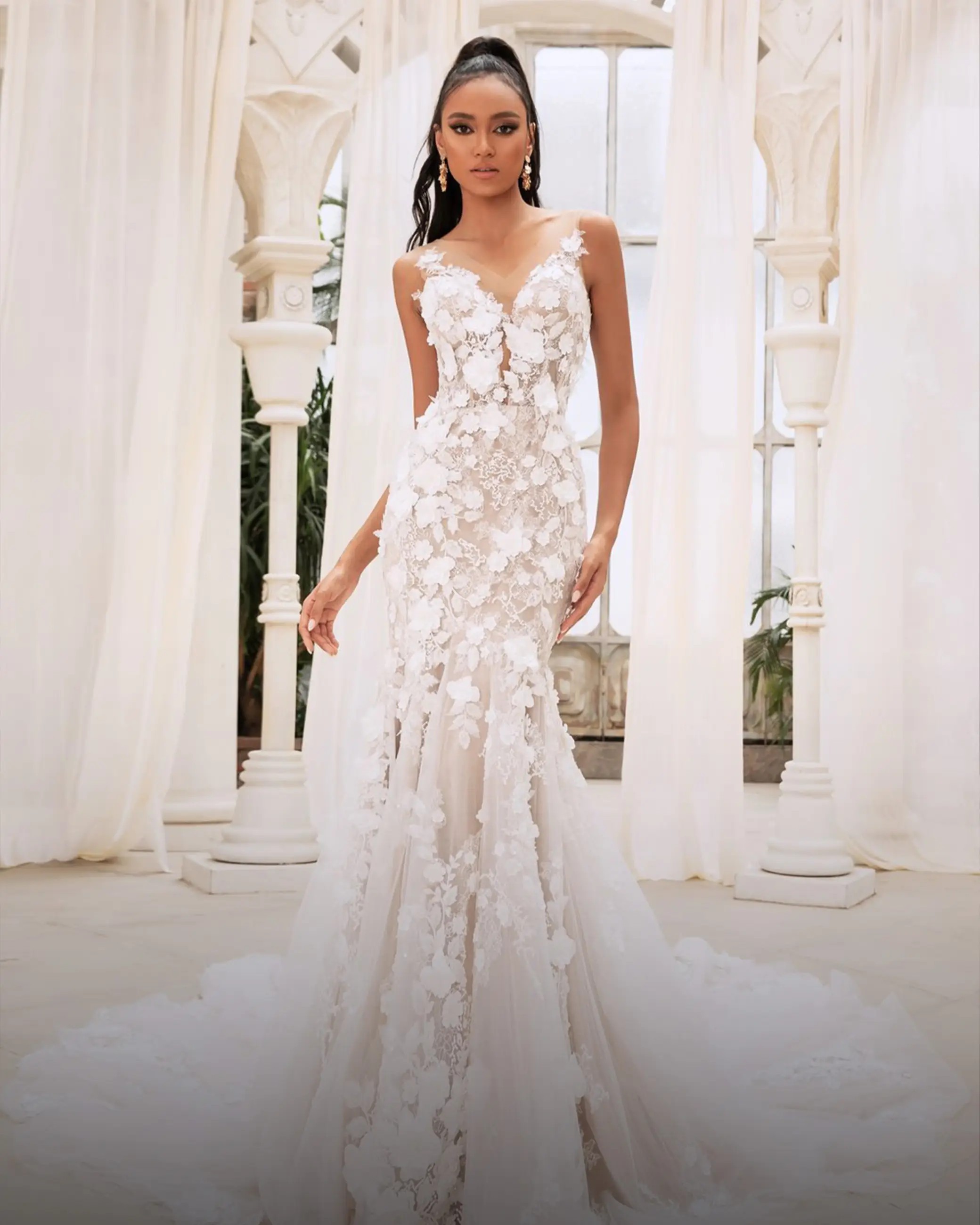 Model wearing a white gown by Mermaid, Orlando bridal shop